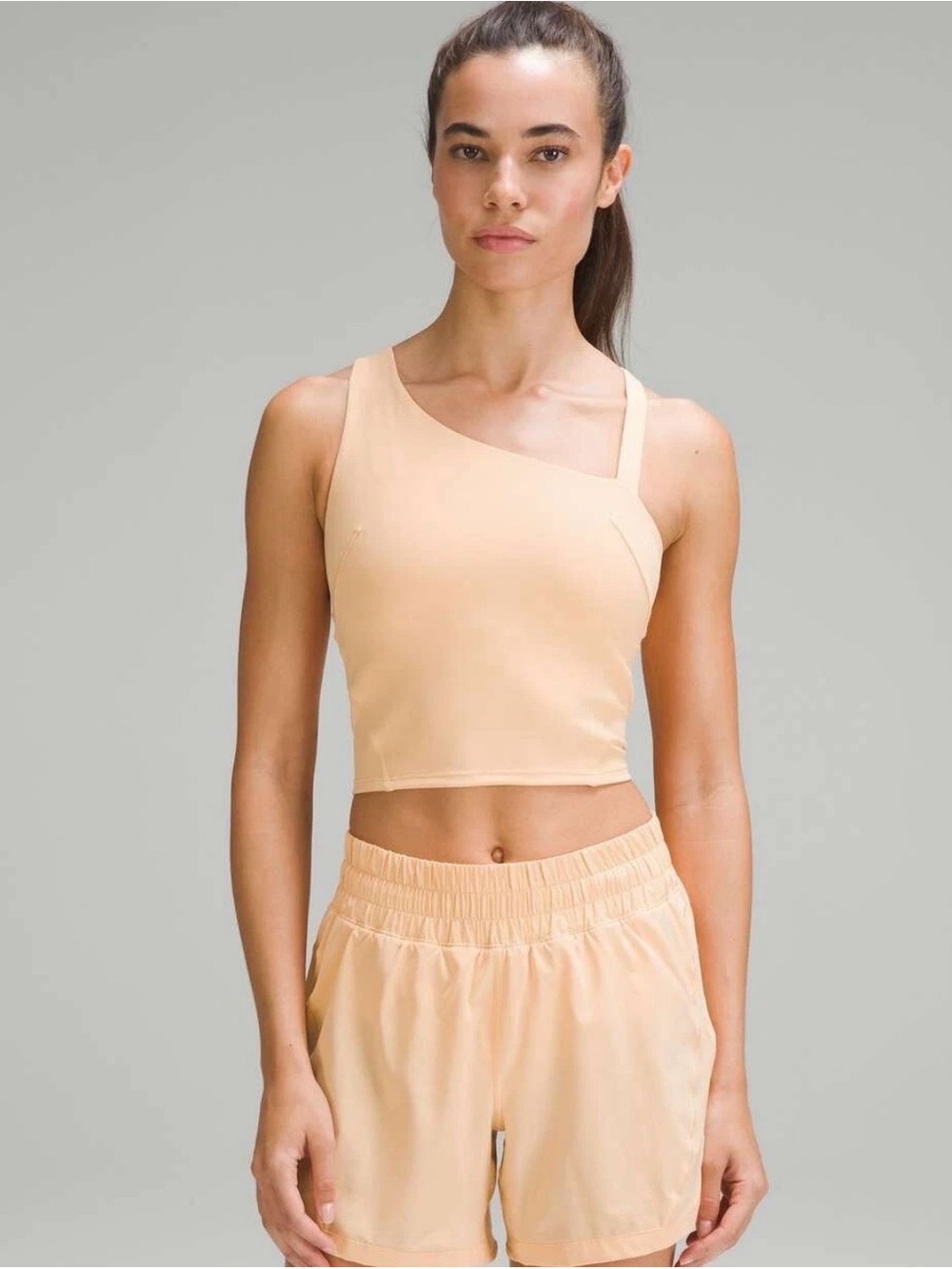 LULULEMON "Everlux
Asymmetrical Tennis Tank" in Summer Glow size 6
